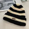 Korean version of the autumn and winter knitted hat stripes warm heart fashion with a small minority princess small fragrance and foreign air bag ear warm explosion