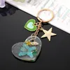 Keychains Clear Real Drooged Flower Resin Daisy Petal Heart Star Pendant Metal Key Chain Lobster Clasp Keyring Holder Party Cadeau sieraden