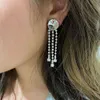 Svarta bågörhängen Miumius Designer lyxmode med asymmetriska långa tofsörhängen perfekt för flickors semestergåva