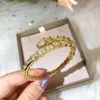 Gioielleria aperta con bracciale aperto con diamanti a forma di serpente in oro 18 carati di vendita calda con un design alla moda che non sbiadisce
