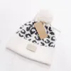 Moda malha gorro para mulher designer leopardo impressão flangeando gorros senhora quente inverno pom pom chapéu 5 cores