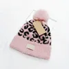 Moda malha gorro para mulher designer leopardo impressão flangeando gorros senhora quente inverno pom pom chapéu 5 cores