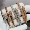 Hot selling 18k gold snake shaped diamond set open bangle jewelry with fashionable design that does not fade