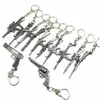 Whole 50pcs Lot Game Gun Model Key Chain Metal Alloy Key Rings Keys Holders Size 6cm Blister Card Package Key Chains261V