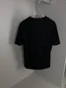 T-shirt da uomo 2023 Primavera / Estate Girocollo T-shirt a maniche corte Moda Splice Morbido e confortevole Bianco Nero Top di alta qualità