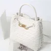 2024 Cowhide Spring/summer Metal Rope Buckle Handheld Woven Bag Commuter One Shoulder Crossbody Handbag for Women