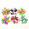 Ropa para perros 100pc / lote Cintas Grooming Bows Cat Hair Bandas de goma Primavera Verano Accesorios para mascotas