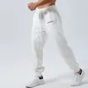 Calças masculinas soltas carta impressão cordão elástico na cintura calças outono casual jogger sweatpants com bolsos