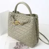 2024 Cowhide Spring/summer Metal Rope Buckle Handheld Woven Bag Commuter One Shoulder Crossbody Handbag for Women