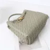 2024 Cowhide Spring/summer Metal Rope Buckle Handheld Woven Bag Commuter One Shoulder Crossbody Handbag for Women