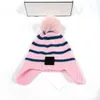 Bonnets en peluche pour enfants, bonnet tricoté de styliste pour garçons et filles, chapeaux chauds, Pom Pom, protection d'oreille pour enfants, bonnets à rayures, hiver