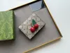 Moda Cherry damska krótka portfel luksusowa klapka składana torebki torby sprzęgła designerka metalowe litery żeńskie portfel do przechowywania kieszeń