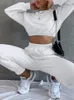 Dwuczęściowe spodnie kobiet białe 2 zestawy damskie stroje 2023 Jezatkowy długie rękawie pullover elastyczne kieszenie w talii spodnie