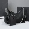 Torba designerska damska luksusowa torebka torby crossbody cowhide TRAMP pod pachami 1BH204 torebka 3 -częściowa torba na ramię złota i srebrne łańcuchy czarne portfel pół miesiąca torba