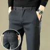 Pantaloni da uomo 2023 Autunno The Men Casual Business Office Pantaloni elastici in vita spessi classici pantaloni slim uomo nero grigio marrone