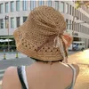 Chapeaux à large bord Chapeau de seau de paille de vacances coréennes Femmes d'été Respirant Pare-soleil Crème solaire Bord de mer Pliable Strap-on Sun Cap