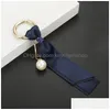 Nyckelringar tyg band pärla nyckelchain charm hänge dekorativ elegent kedja guldmetall ringväska för kvinnor smycken droppleverans dhizx