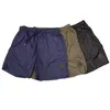 Shorts de créateurs pour hommes, badges classiques, shorts de plage pour hommes, pantalons légers et fins à séchage rapide, shorts de sport 3/4, shorts de course décontractés en plein air