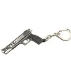 Anelli chiave all'ingrosso 50pcs/lotto Game pistola modello a catena in lega metallo in lega di tasti dimensioni da 6 cm pacchetto di schede blister catene di consegna gioielli dhg06