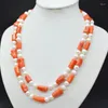 Tour de cou Unique 2 Rangs. Collier de corail irrégulier orange et de perles naturelles. Les bijoux de mariée de style ethnique africain les plus classiques