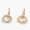 Boucles d'oreilles Carttiers Designer Luxe Mode FemmesNouvelle Tendance Haut de Gamme Sentiment Capable Atmosphère Diamant Incrusté Trois Couleurs Boucles D'oreilles Circulaires