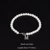 Beaded Bangle 2023 Nytt mode A-Z Inledande armband Men Classic Imitation Pearl Stainless Steel Letter Pendant For Jewelry Gift 230925