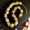 チョーカーレトロシーシェル巻き本魚の真珠のネックレス用のゴールドカラーメタルクラビクルチェーンヨーロッパとアメリカの女性向け230927
