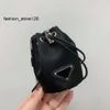 Porte-clés de luxe Mini sac designer beau portefeuille de changement fait à la main en cuir porte-clés mode hommes et femmes sac à main pendentif accessoires QURP