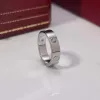 Кольца-кольца Новое ювелирное кольцо Love Ring Золотое кольцо для женщин Титановый стальной сплав Позолоченный процесс Модные аксессуары Золотые украшения для влюбленных