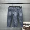 Herr jeans designer korrekt topputgåva högkvalitativa lilla monster ögon fötter byxor avslappnad smal passform mångsidig