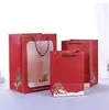 حقيبة حمل هدايا عيد الميلاد الأحمر مع مقابض كيس عيد الميلاد جودي مع حقيبة علاج قابلة لإعادة الاستخدام للنافذة للهدايا