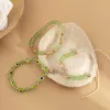 Bracelets de charme Vivilady empilé vert perlé croix démon oeil zircon alliage bijoux faits à la main pour les femmes mode fête cadeau en gros