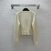 2023 Autumn Black / Beige Solid Color Beaded Knitted Sweater Long Sleeve Round Neck Rhinestone Pullover Style Sweaters B3S242354
