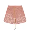 2023 Tide Brand Designer Shorts pour hommes Rhude Lettre Imprimer Mode Pantalons de plage Sports High Street Shorts amples Casual Polyvalent Européen S-XL