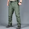 Mäns byxor Mens Tactical Pants Flera fickelasticitet Militär Urban Tacitcal byxor Män vattentät lastbyxa 6xl 230927