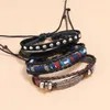 Braccialetti con ciondoli Moda Etnica Vintage Multistrato Set in pelle di piume Rivetti intrecciati Braccialetti Bracciale avvolgente Gioielli punk unisex