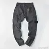 Yüksek kaliteli rozet yamaları erkek izi taş pantolon moda mektupları tasarımcı jogger pantolon kargo fermuar uzun spor pantolonları 4homme giyim adası 2KKKF