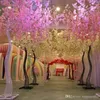 Fleurs décoratives blanc artificiel cerisier fleur arbre route plomb Simulation fleur avec cadre en arc de fer pour les accessoires de fête de mariage