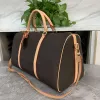 2023 Designers Mode Sacs Duffel Hommes de luxe Femmes Sacs de voyage Sacs à main en cuir Grande capacité Holdall Bagages Sac de week-end avec serrure 41414