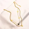 Nunca se desvanece 18K chapado en oro Diseñador de la marca Carta Collares pendientes Mujeres famosas Cristal Rhinestone Gargantilla de acero inoxidable Neckl210u