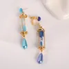 Boucles d'oreilles pendantes Vanitas, sablier bleu, goutte d'anime, étude de cas de Clips d'oreille antiallergiques, bijoux à boucle en os