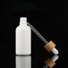 10 ml 15 ml 30 ml witte essentiële olie druppelflesje cosmetische glazen pipet verpakking container met houtnerf bamboe deksel cap1212J