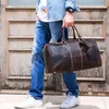 man leather travel bag carry