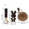 Bunny Design Nyckelringar Ring Pompom Ball Kaninväska Hänge Charm Nyckelring Spänne Present Smycken Tillbehör PU Läder Brun Blomma Djursnodd Bilnyckelringhållare