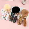 Bunny Ontwerp Sleutelhangers Ring Pompom Bal Konijn Tas Hanger Bedel Sleutelhanger Gesp Geschenk Sieraden Accessoires PU Leer Bruin Bloem Dier Lanyard Auto Sleutelhanger Houder