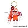 Keychains lanyards draaiende rode cartoon panda siliconen sleutelhanger geanimeerde perifere bel rugzak hangers geschenken voor jongens en meisjes groothandel 230103