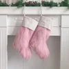 Decorações de Natal estocando ornamentos de pele de pele branca rosa