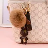 Bunny Ontwerp Sleutelhangers Ring Pompom Bal Konijn Tas Hanger Bedel Sleutelhanger Gesp Geschenk Sieraden Accessoires PU Leer Bruin Bloem Dier Lanyard Auto Sleutelhanger Houder