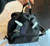 Unisex Fashion Handbags 나일론 백팩 학교 가방 검은 백 팩 삼각형 표지판 어깨 가방 여러 주머니