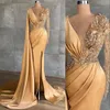 Sexy Gold Evening Dresses Wear Jewel Neck Illusion Mermaid Side Split Lace Appliques Crystal Beaded Pearls Long Sleeves Feather Formal Party Dress Prom Gowns